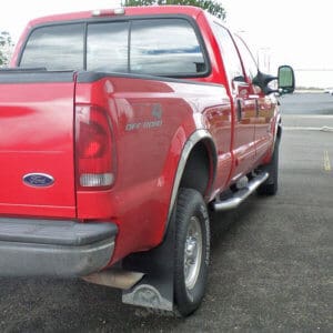 towable RV mud flaps on 2003 Ford F-350 SRW with 12" wide extra long rears for protecting a tow vehicle, with Elk Artwork