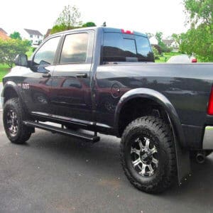Mud flaps with black weights on Dodge 1500
